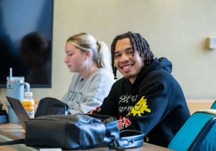A student smiles while in class