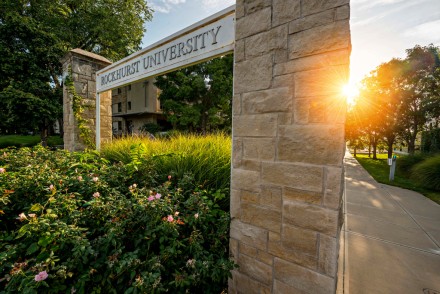 Welcome gate with sunrise behind the pillars