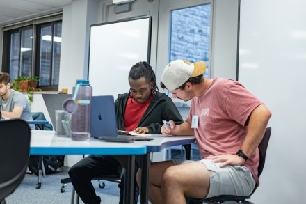 Two male students study together at the Learning Center